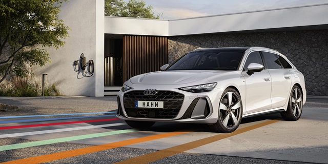 Der Audi A6 Avant eHybrid in weiß und in der Frontansicht mit dem HAHN-Schriftzug als Kennzeichen.